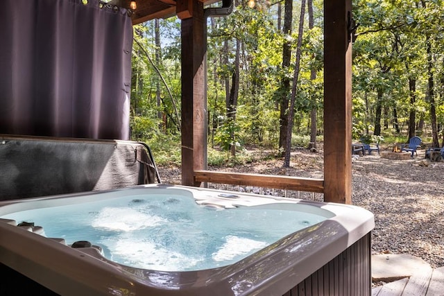 misc room featuring a jacuzzi and wood-type flooring