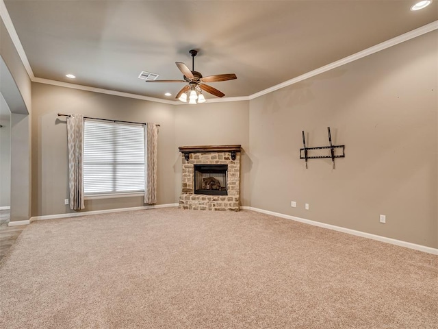 unfurnished living room featuring carpet floors, a brick fireplace, ceiling fan, and ornamental molding