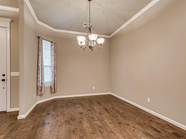 unfurnished room featuring a chandelier, dark hardwood / wood-style floors, and ornamental molding