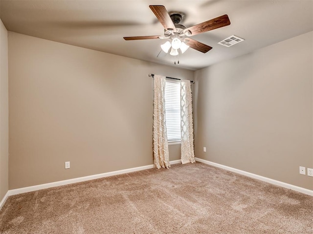 carpeted empty room with ceiling fan