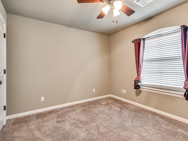 unfurnished room featuring carpet floors and ceiling fan