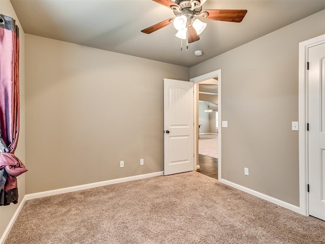 unfurnished bedroom featuring carpet flooring and ceiling fan