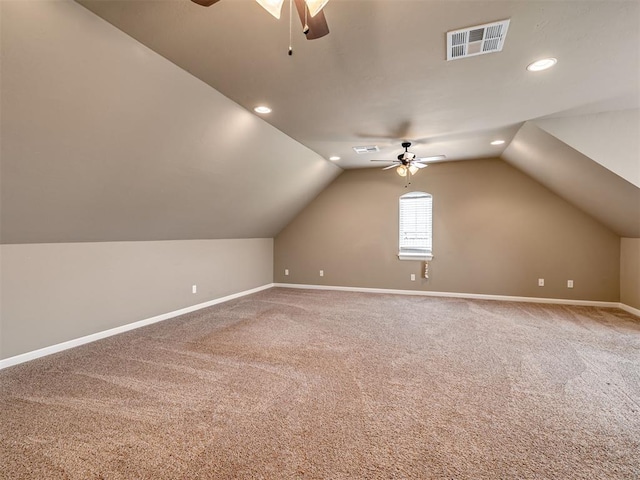 bonus room with carpet flooring, ceiling fan, and lofted ceiling