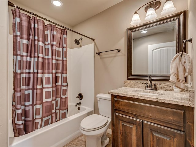 full bathroom featuring shower / tub combo with curtain, vanity, and toilet