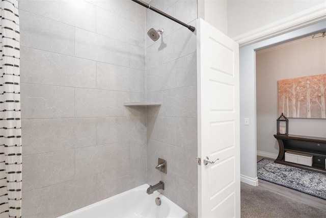 bathroom featuring shower / bathtub combination with curtain