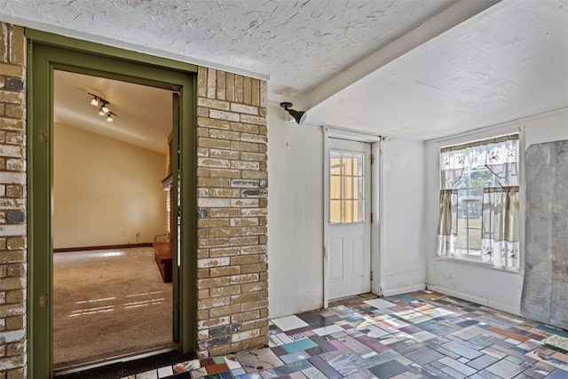 interior space with a textured ceiling