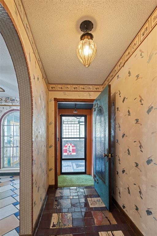 entryway featuring a textured ceiling