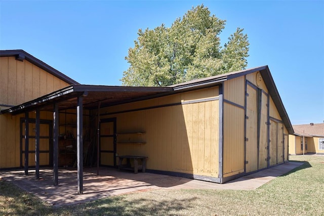 view of outdoor structure with a lawn