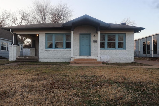 view of front of home with a front lawn