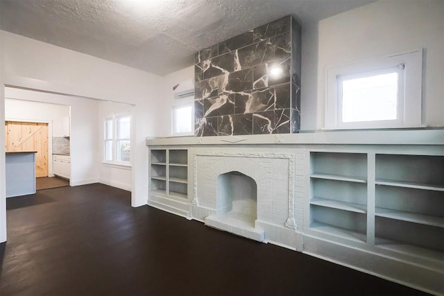 unfurnished living room with a textured ceiling