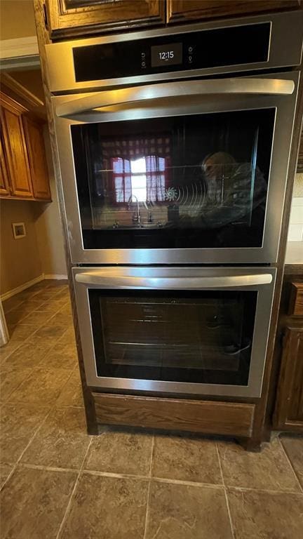 interior details featuring stainless steel double oven