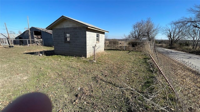 view of side of home with an outdoor structure