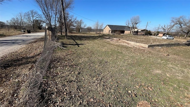 view of yard with a rural view