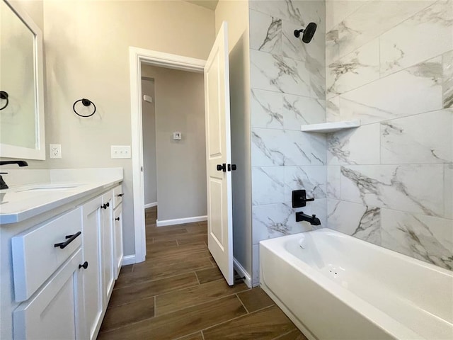 full bathroom with wood tiled floor, vanity, baseboards, and bathing tub / shower combination