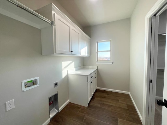 washroom with washer hookup, dark wood finished floors, cabinet space, hookup for an electric dryer, and baseboards