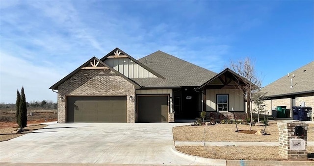 craftsman-style house with a garage, a shingled roof, board and batten siding, and concrete driveway