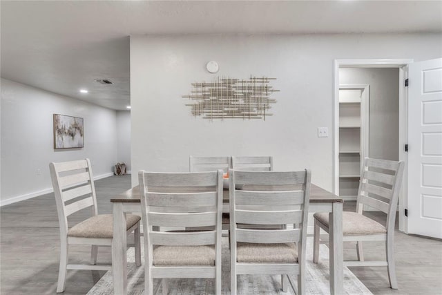 dining area with wood-type flooring