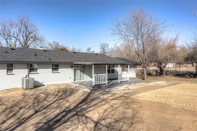 rear view of house featuring a patio and central AC unit