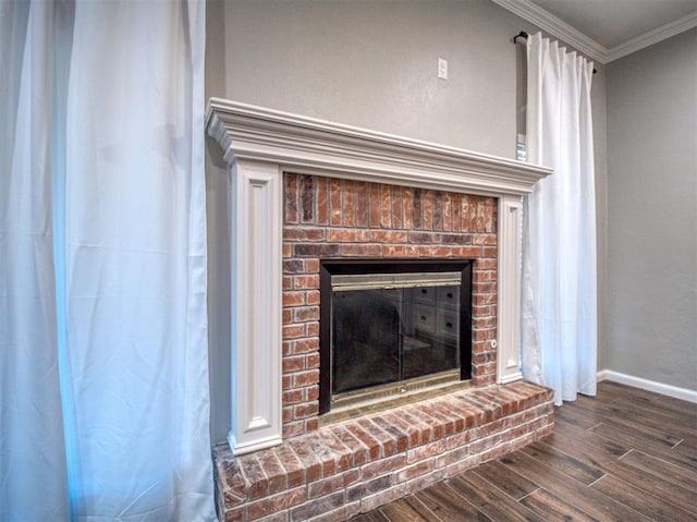 room details with hardwood / wood-style flooring, crown molding, and a fireplace