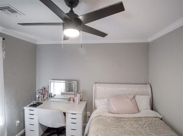 bedroom with ceiling fan and crown molding