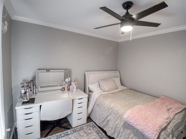 bedroom with ceiling fan, ornamental molding, and light hardwood / wood-style flooring