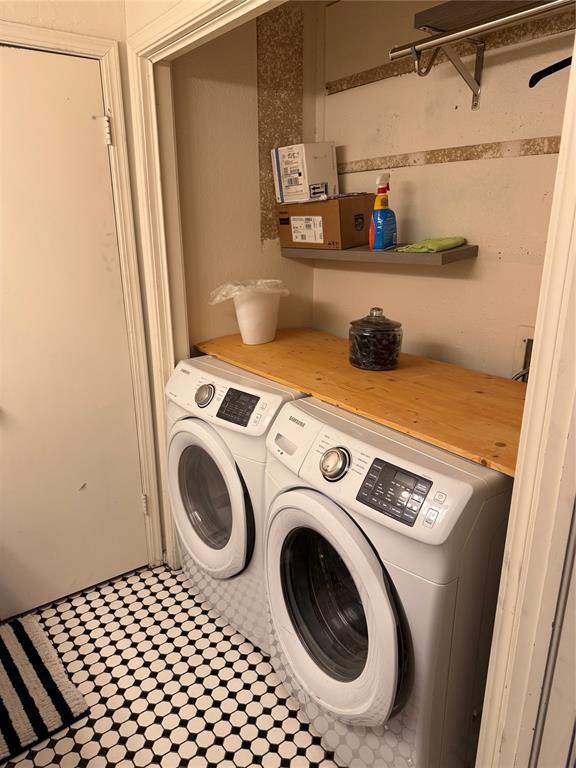 laundry area with laundry area and separate washer and dryer