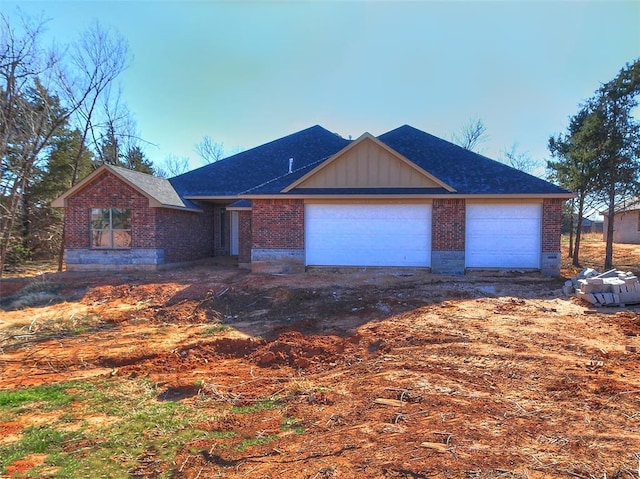 ranch-style house featuring a garage