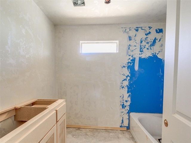 bathroom featuring a washtub