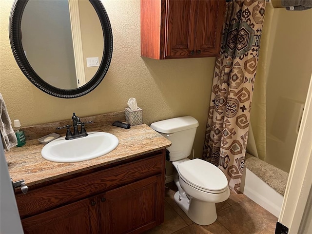 full bathroom with tile patterned flooring, vanity, toilet, and shower / bath combo with shower curtain