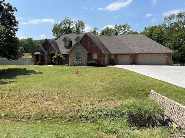 view of front of property with a garage and a front lawn