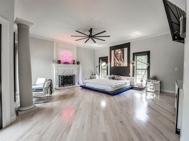 unfurnished bedroom with ceiling fan, light hardwood / wood-style floors, and ornamental molding