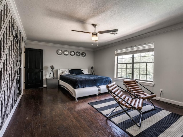 bedroom with a textured ceiling, dark hardwood / wood-style flooring, ceiling fan, and crown molding