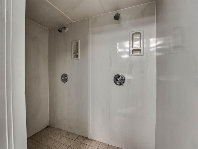 bathroom with tile patterned floors and walk in shower