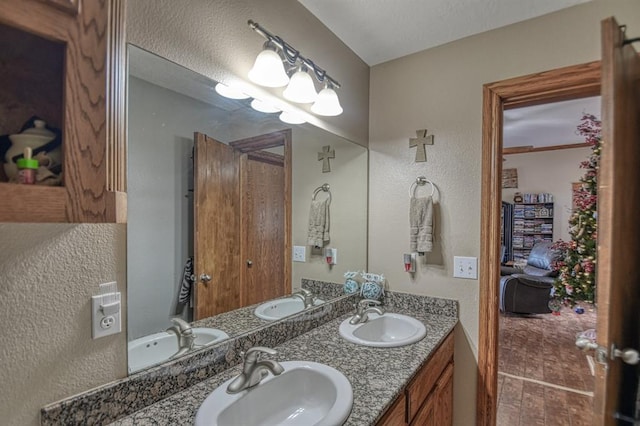 bathroom with vanity and a textured ceiling