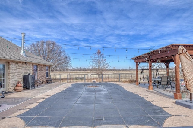 view of patio featuring a rural view and grilling area