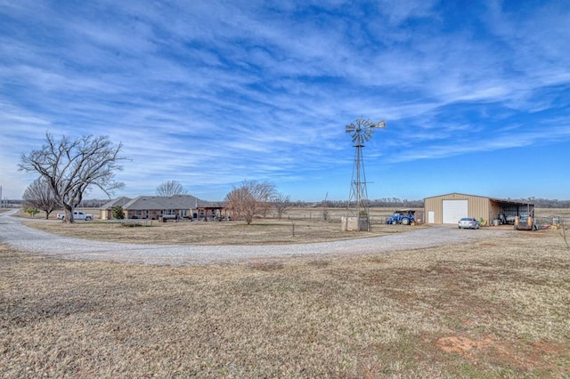 view of yard featuring an outbuilding and a garage