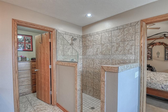 ensuite bathroom with walk in shower and recessed lighting