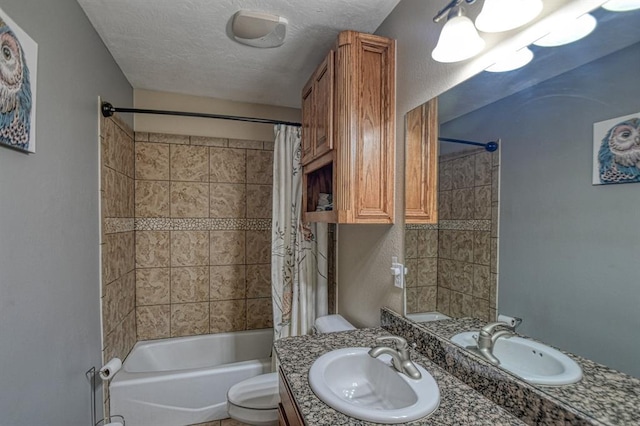 bathroom with toilet, shower / bath combination with curtain, vanity, and a textured ceiling