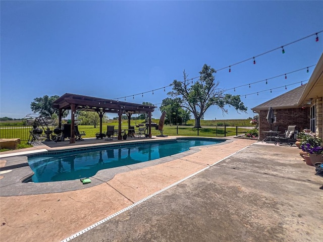 view of swimming pool with a gazebo and a patio area