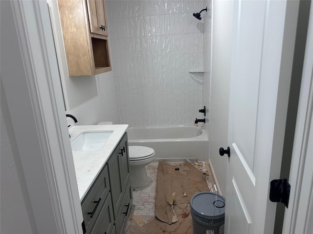 full bathroom with toilet, vanity, and tiled shower / bath combo