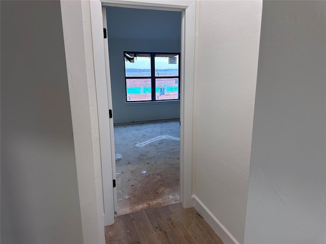 corridor featuring hardwood / wood-style floors