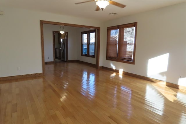 unfurnished room featuring hardwood / wood-style flooring and ceiling fan