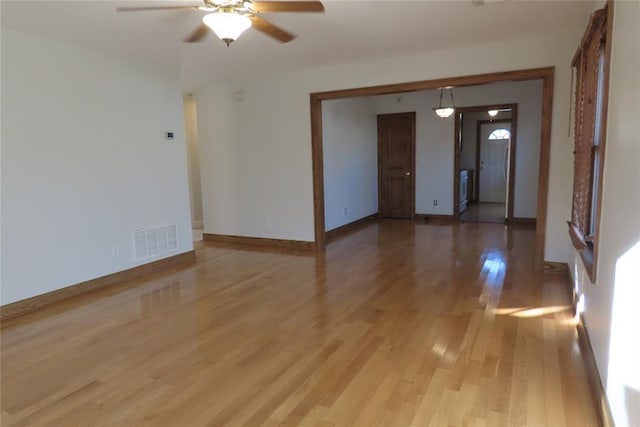 spare room featuring light wood-type flooring and ceiling fan