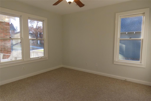 carpeted empty room with ceiling fan