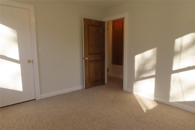 empty room featuring light colored carpet