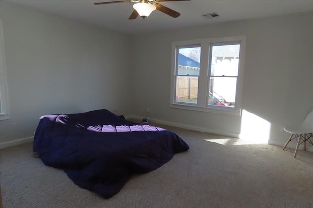 bedroom with ceiling fan and carpet