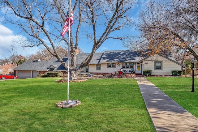 ranch-style home featuring a front yard