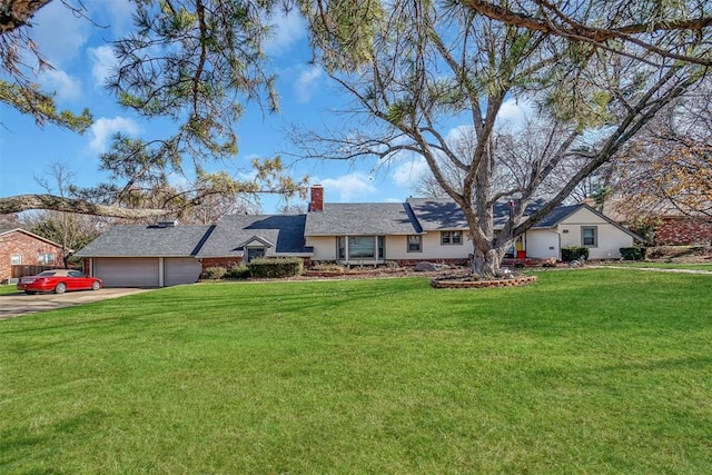 single story home featuring a front yard and a garage