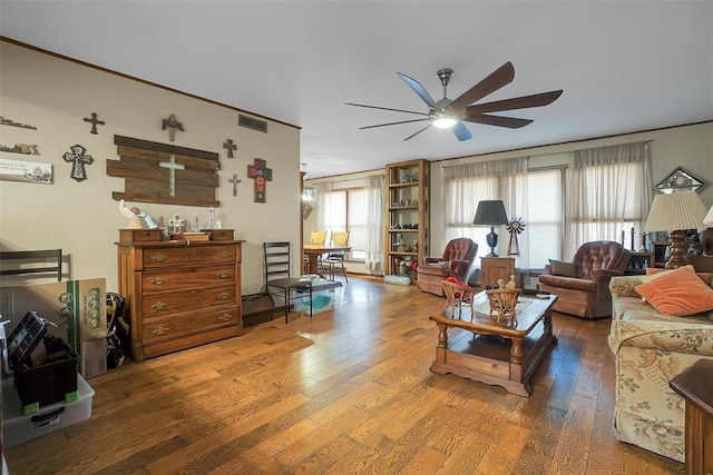 living room featuring ceiling fan and wood-type flooring