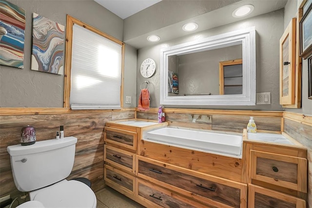 bathroom with tile patterned floors, vanity, and toilet